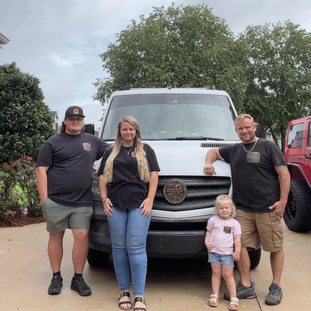 The Rolling Stone Auto Repair team with their mobile service van in Warner Robins, GA