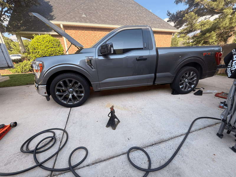 mobile mechanic working on a pickup in a Warner Robins driveway